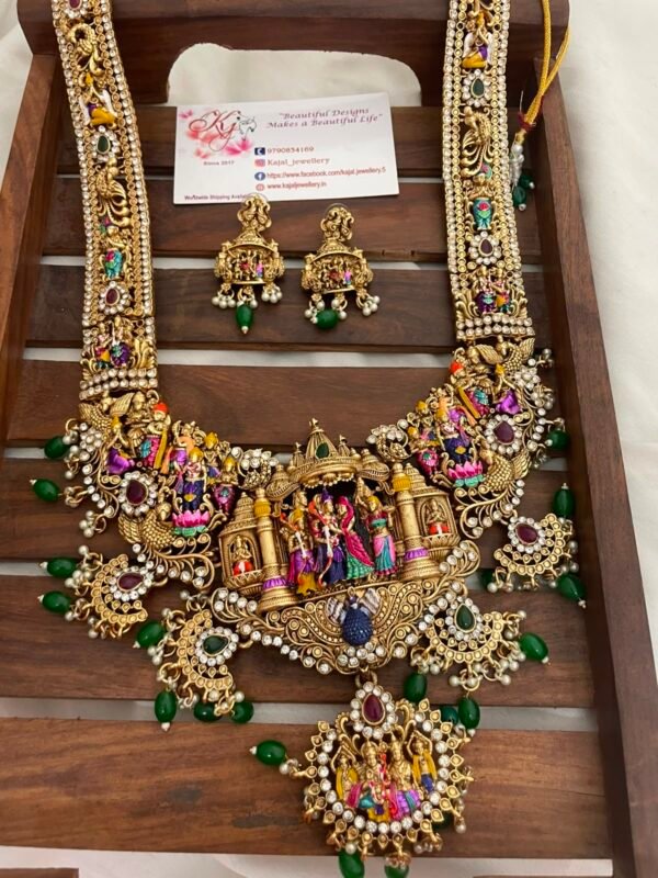 87f34dfd-3f26-463f-b34b-72651d9141bd Heavy meenakari white stone model green beads long set